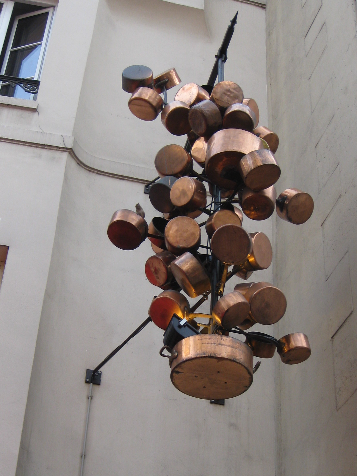 Pots and pans hanging outside a cafe