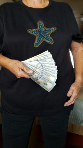 Susan shows her casino winnings. 